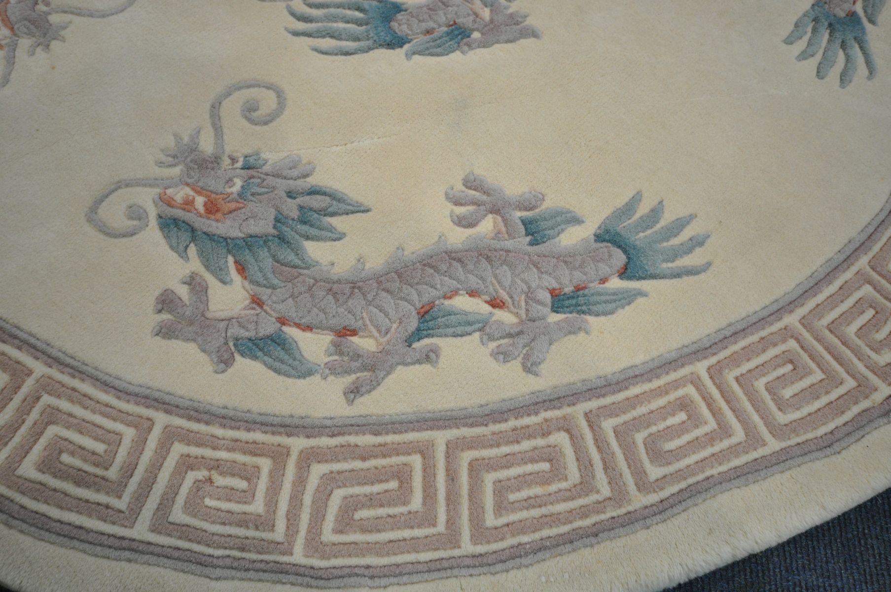 A CIRCULAR CREAM CHINESE RUG, with a dragon pattern, diameter 155cm - Image 2 of 4