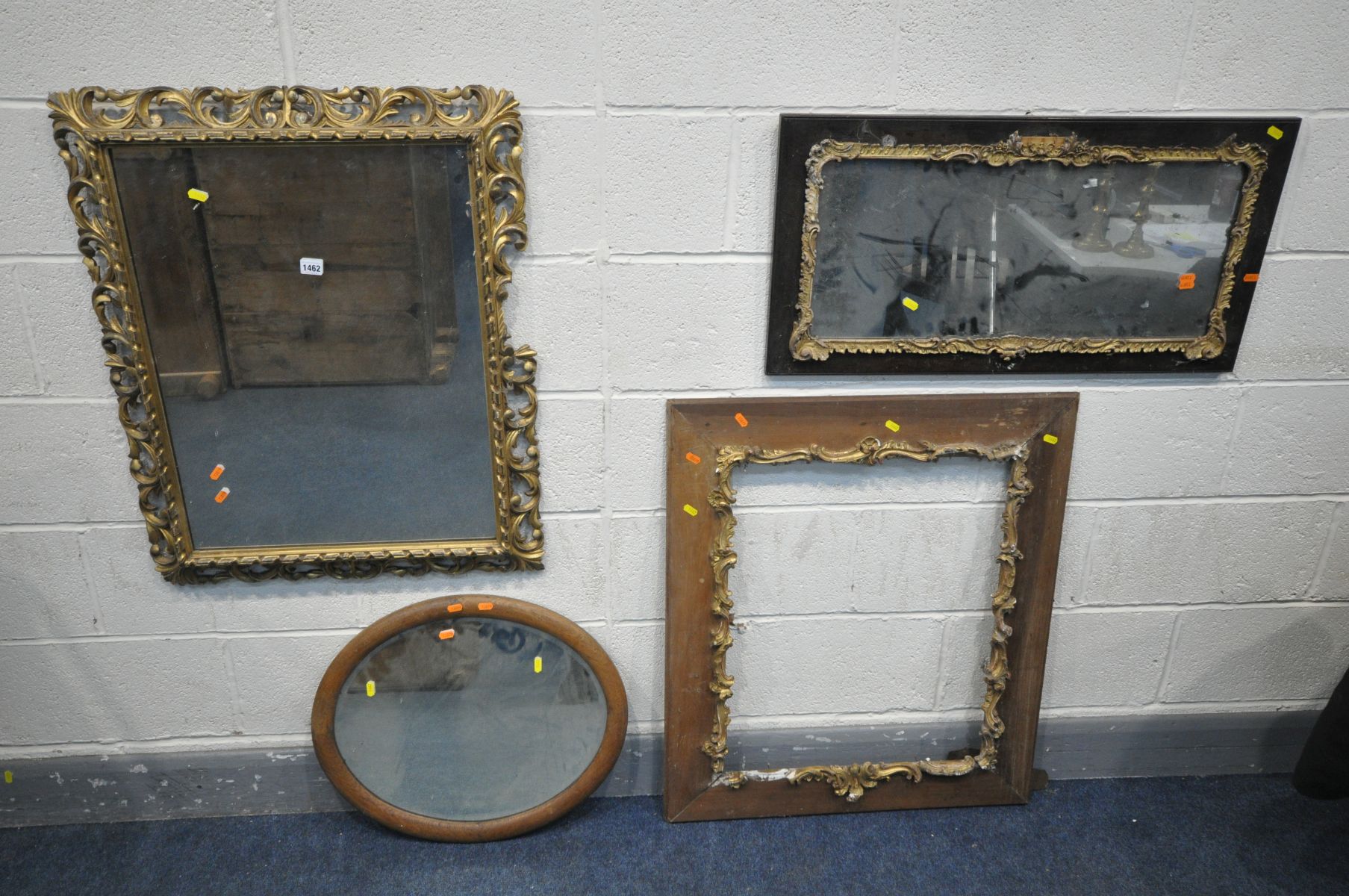 A 19TH CENTURY ROCOCO REVIVAL GILTWOOD WALL MIRROR, the plain rectangular plate within a frame