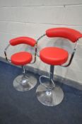 A PAIR OF STEFIX RED LEATHERETTE ADJUSTABLE HIGH STOOLS (condition - some rust spots to base)
