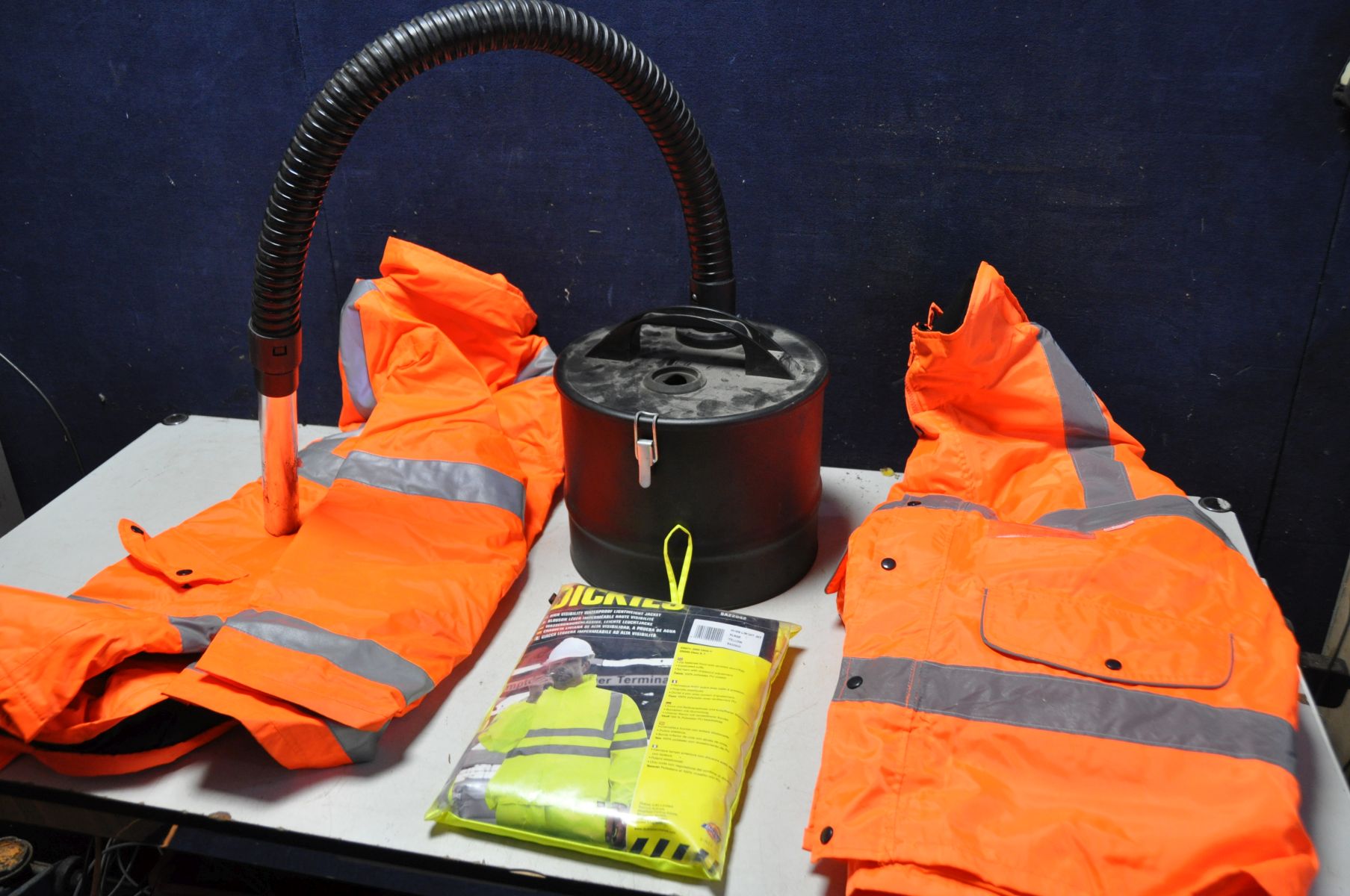 A COOPERS METAL VACUUM POWERED ASH BIN, along with three high visibility jackets two orange, one - Image 2 of 2