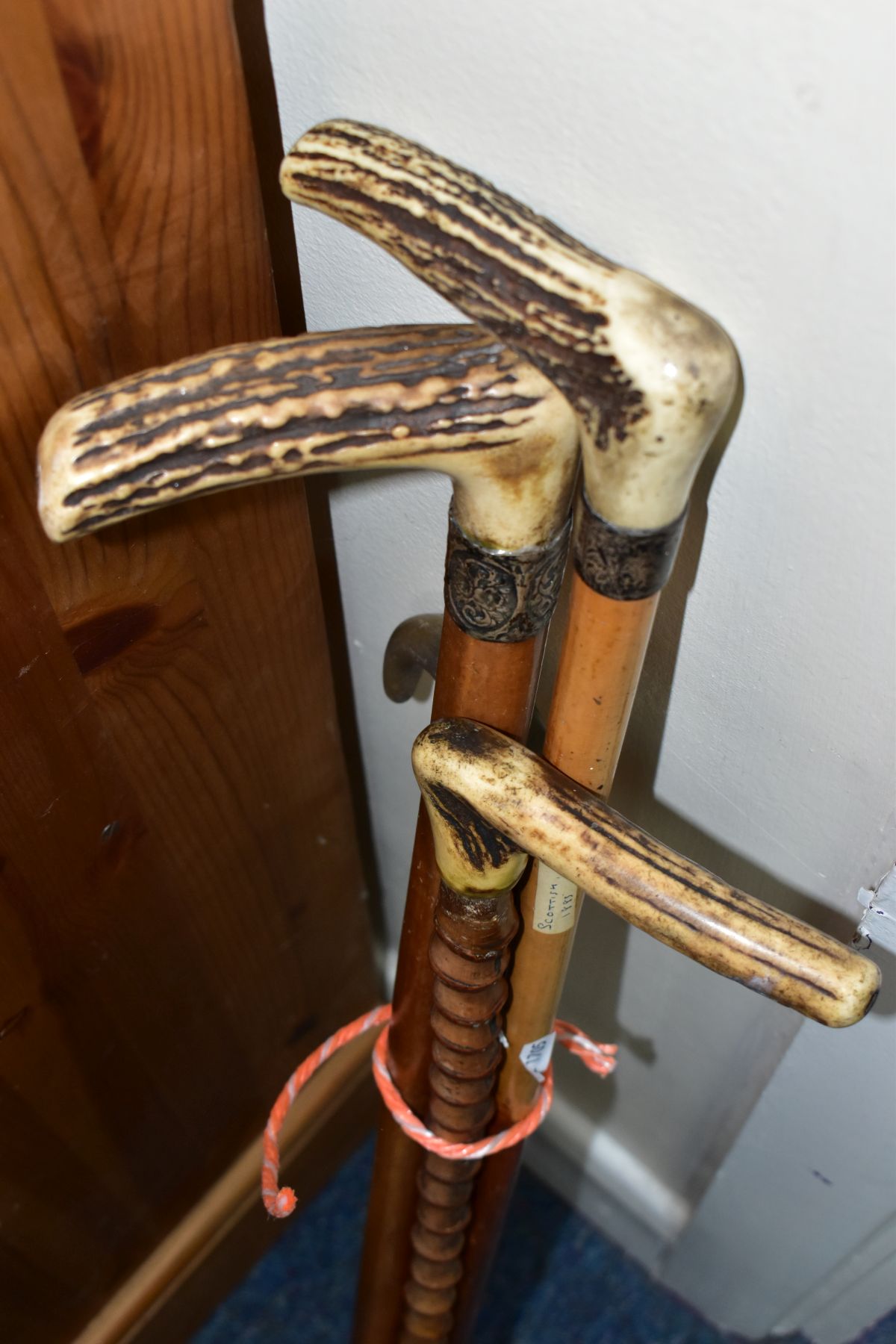 FOUR WALKING STICKS, various materials, one malacca stick, three have antler handles, one with a - Image 10 of 10
