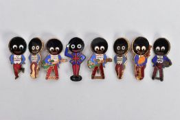 EIGHT ROBERTSONS GOLDEN SHRED MASCOT BROOCHES, to include a guitar player, bagpipe player, tennis