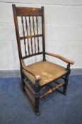 A 19TH CENTURY LANCASHIRE ROCKING CHAIR, with a rush seat (condition:-rush seat worn)