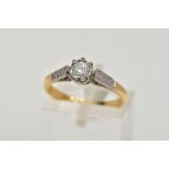 A YELLOW METAL SINGLE STONE DIAMOND RING, designed with a claw set round brilliant cut diamond,