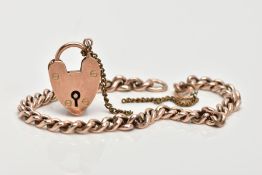 A YELLOW METAL CURB LINK BRACELET WITH HEART CLASP, curb link chain (unmarked) broken base metal