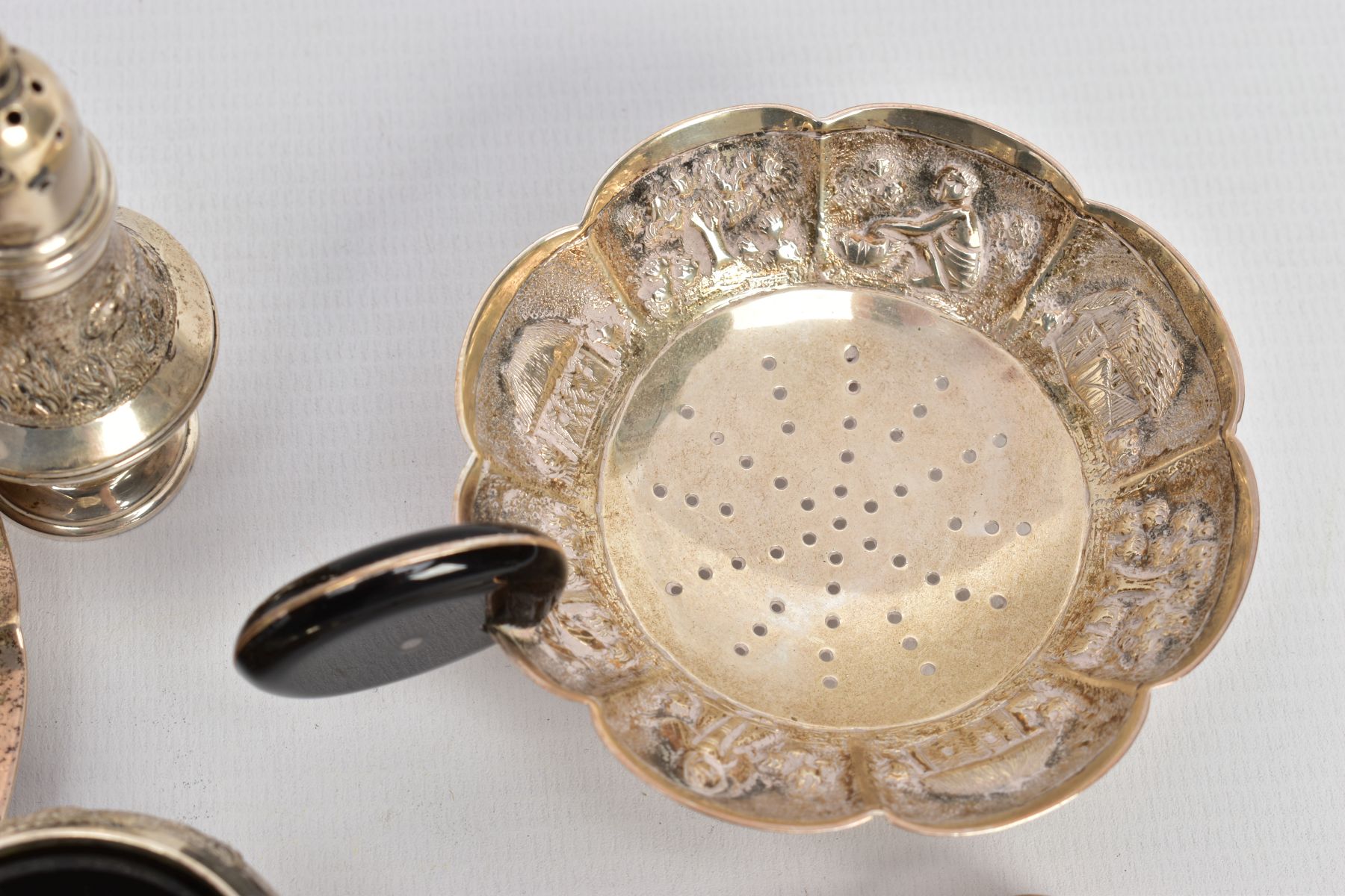A SELECTION OF INDIAN WHITE METAL ITEMS, to include a white metal tea strainer with a circular - Image 9 of 10