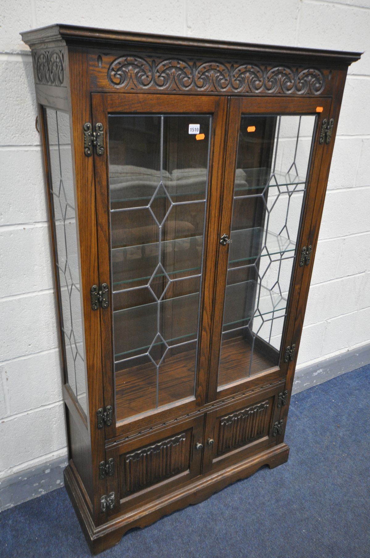 AN OLD CHARM OAK LEAD GLAZED TWO DOOR BOOKCASE, width 89cm x depth 34cm x height 157cm (key)