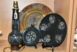 FOUR PIECES OF INDIAN AND MIDDLE EASTERN METALWARE, comprising a brass charger overlaid in relief