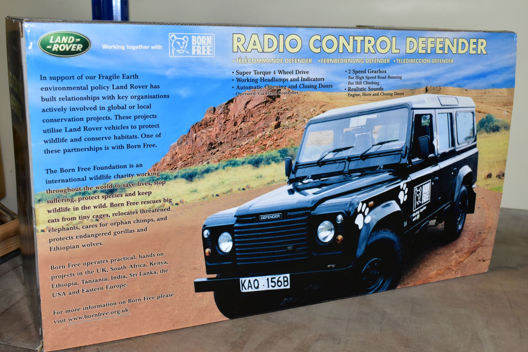 A BOXED RADIO CONTROLLED LAND ROVER DEFENDER, black Born Free edition, in original packaging with - Image 3 of 4