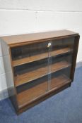 A MID CENTURY TEAK GLAZED BOOKCASE