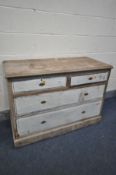 AN EDWARDIAN PINE CHEST OF TWO SHORT AND TWO LONG DRAWERS, with painted drawer fronts, width 113cm x