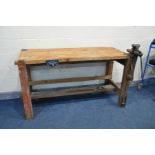 A BESPOKE PINE WORK BENCH, with block legs, plank top, vintage lap vice, modern guardsman's vice and
