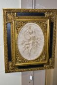 AFTER T P DANBIERE, A HIGH RELIEF CAST MARBLE PLAQUE, depicting a scantily clad female figure and