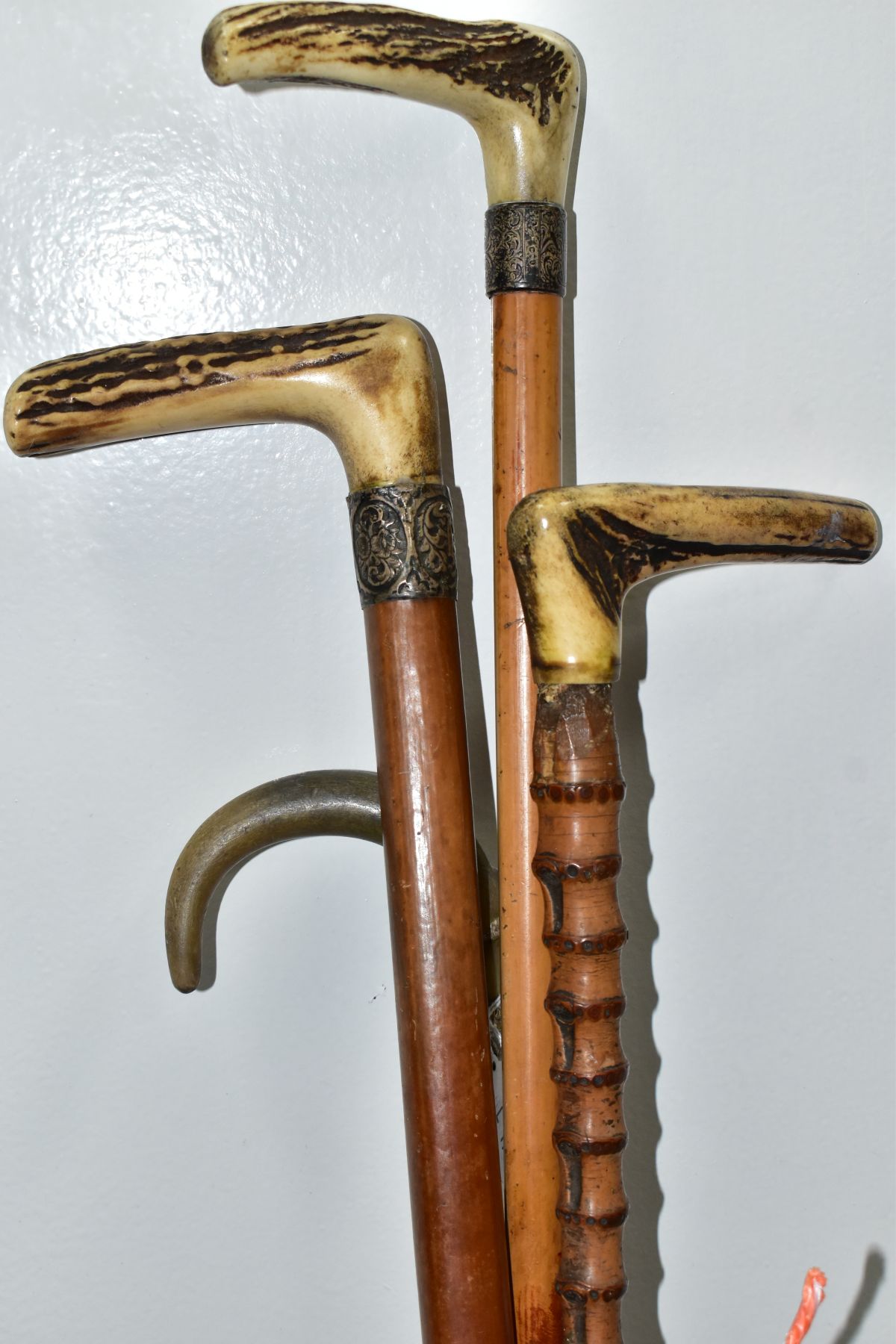 FOUR WALKING STICKS, various materials, one malacca stick, three have antler handles, one with a - Image 6 of 10