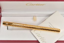 A CASED 'CARTIER' FOUNTAIN PEN, gold-plated trilogy design fountain pen, signed 'Cartier' fitted