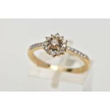 A 9CT GOLD DIAMOND CLUSTER RING, centring on a brown round brilliant cut diamond, within a