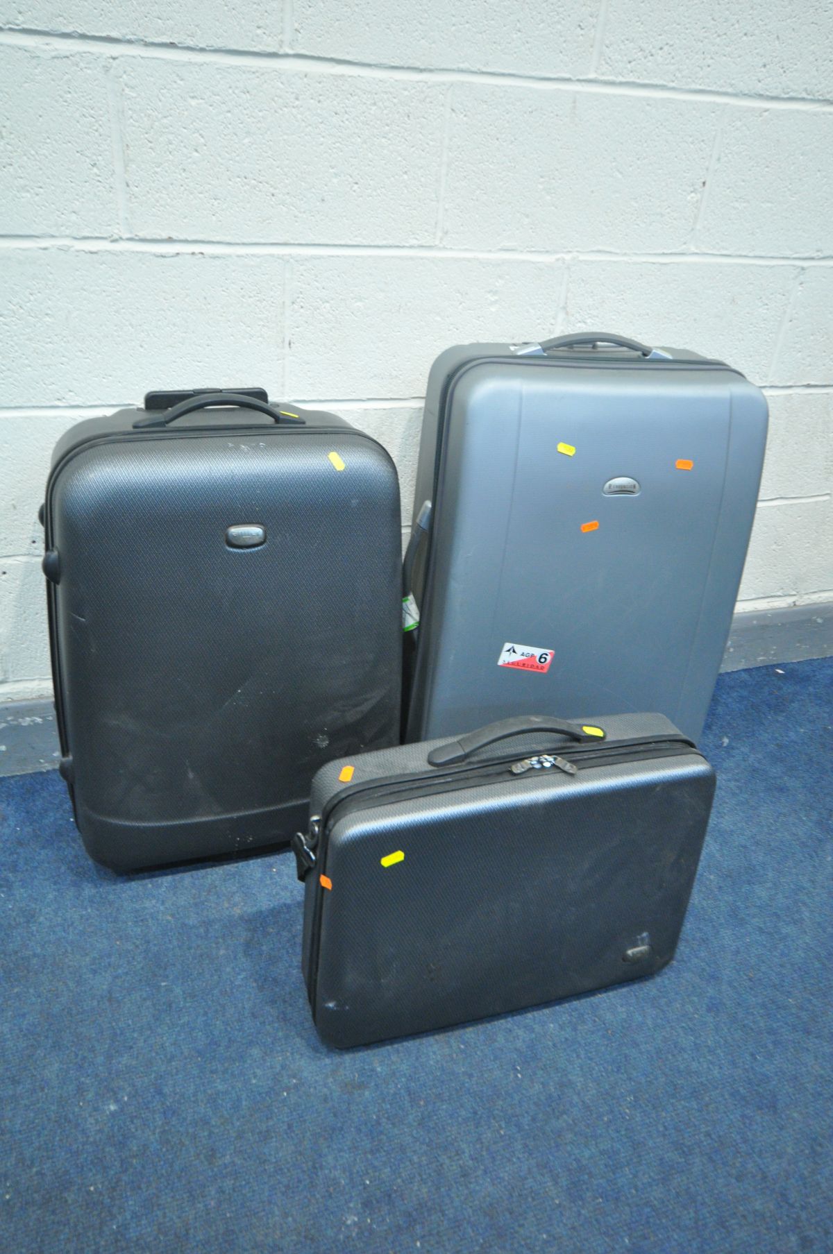 TWO HARDSHELL SUITCASES, including Antler and Revelation, and an Antler Hardshell briefcase (3)