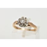 A 9CT GOLD DIAMOND CLUSTER RING, slightly raised cluster within an illusion set single cut diamond