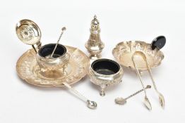 A SELECTION OF INDIAN WHITE METAL ITEMS, to include a white metal tea strainer with a circular