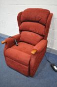 A CIAR RED UPHOLSTERED RISE AND RECLINE ARMCHAIR (PAT pass and working)