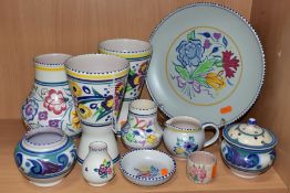 A COLLECTION OF POOLE POTTERY, including two conical vases decorated with deep bands of flowers,