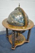 A TERRESTIAL GLOBE DRINKS TROLLEY, the top lifting to reveal a fitted interior painted with a