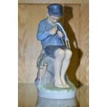 A ROYAL COPENHAGEN FIGURE OF A BOY WHITTLING A STICK, The Wittler no 905 height 18cm, with printed