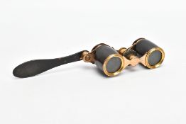 A PAIR OF EDWARDIAN OPERA GLASSES, carved tortoise shell and brass coloured design with a swing