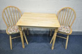 A MODERN BEECH KITCHEN TABLE, width 87cm x depth 67cm x height 75cm and two chairs (3)