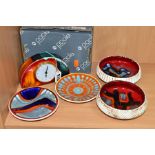 FIVE PIECES OF POOLE POTTERY COMPRISING A BOXED GEMSTONES HALF MOON CLOCK, two circular shallow