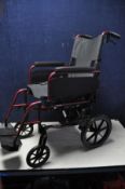 A DASH LITE WHEELCHAIR lightweight folding wheelchair with carry case