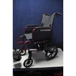 A DASH LITE WHEELCHAIR lightweight folding wheelchair with carry case