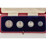 A CASED 'MAUNDY MONEY 1918' SET, four piece George V set, with original fitted case (condition