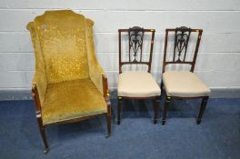 AN EDWARDIAN MAHOGANY AND BOX STRUNG INLAID WING BACK ARMCHAIR, on square tapered legs and brass