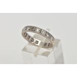 A WHITE METAL FULL DIAMOND ETERNITY RING, channel set with a variety of round brilliant cut,