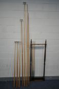 A MAHOGANY SNOOKER CUE STAND, along with two long and two short cues, two long spider cue stands,