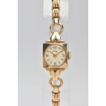 A 9CT GOLD CARA LADY'S WRISTWATCH, the circular white face with Arabic numerals and baton hour