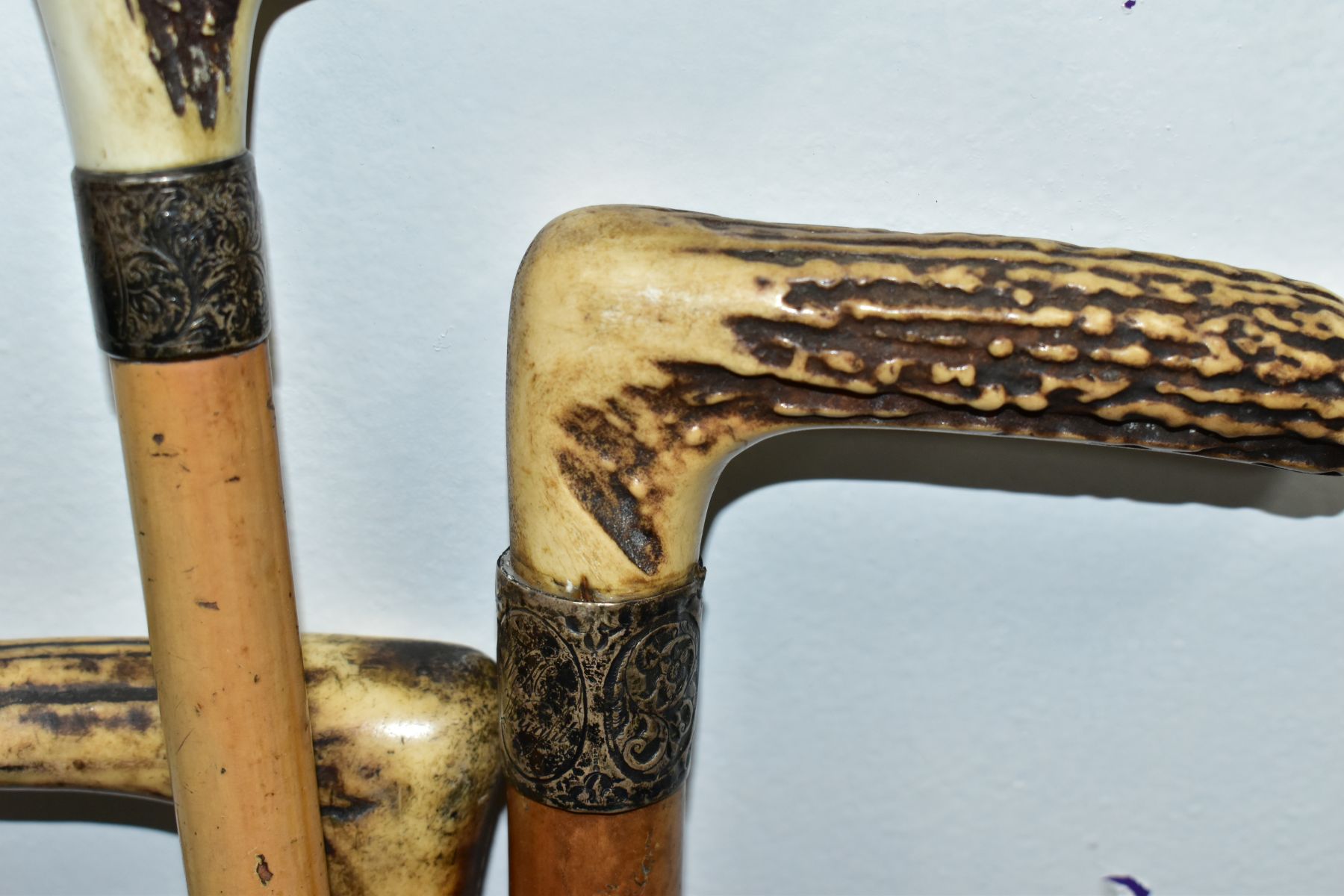 FOUR WALKING STICKS, various materials, one malacca stick, three have antler handles, one with a - Image 4 of 10