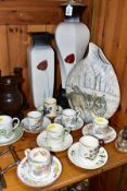 EIGHT ASSORTED COFFEE CANS AND SAUCERS BY WEDGWOOD, COALPORT AND OTHERS, a modern teardrop shaped