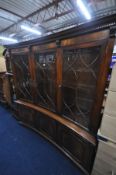 A REPRODUX MAHOGANY CONCAVE TRIPLE DOOR BOOKCASE, with later lighting, width 170cm x depth 45cm x