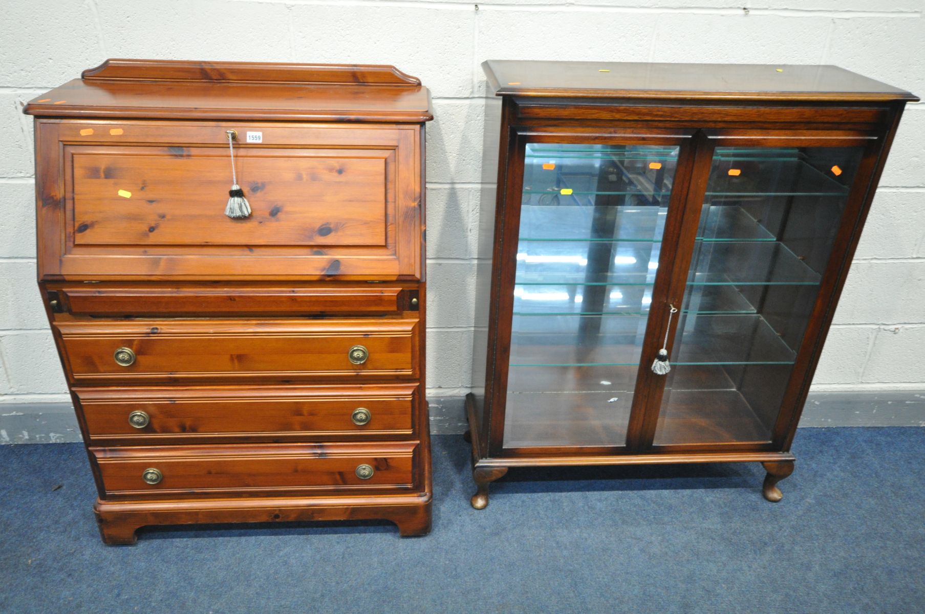 A STAINED PINE BUREAU, with a fitted interior, above a secret drawer and three drawers, width 87cm x