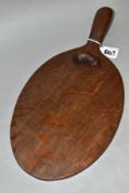 A ROBERT THOMPSON MOUSEMAN OAK CHEESE BOARD, waxed and dark oak oiled finish, oval form, length 36.