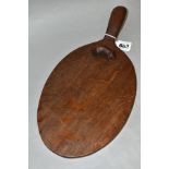 A ROBERT THOMPSON MOUSEMAN OAK CHEESE BOARD, waxed and dark oak oiled finish, oval form, length 36.