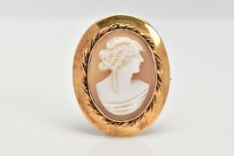 A YELLOW METAL CAMEO BROOCH, of an oval form, depicting a lady in profile, collet mount with a