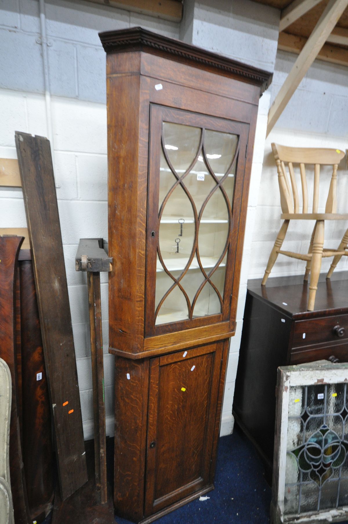 A GEORGIAN OAK WAVY ASTRAGAL GLAZED HANGING CORNER CUPBOARD, width 72cm x depth 45cm x height