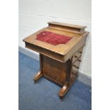 A LATE VICTORIAN WALNUT DAVENPORT, with a red baize inlay, four drawers and dummy drawers