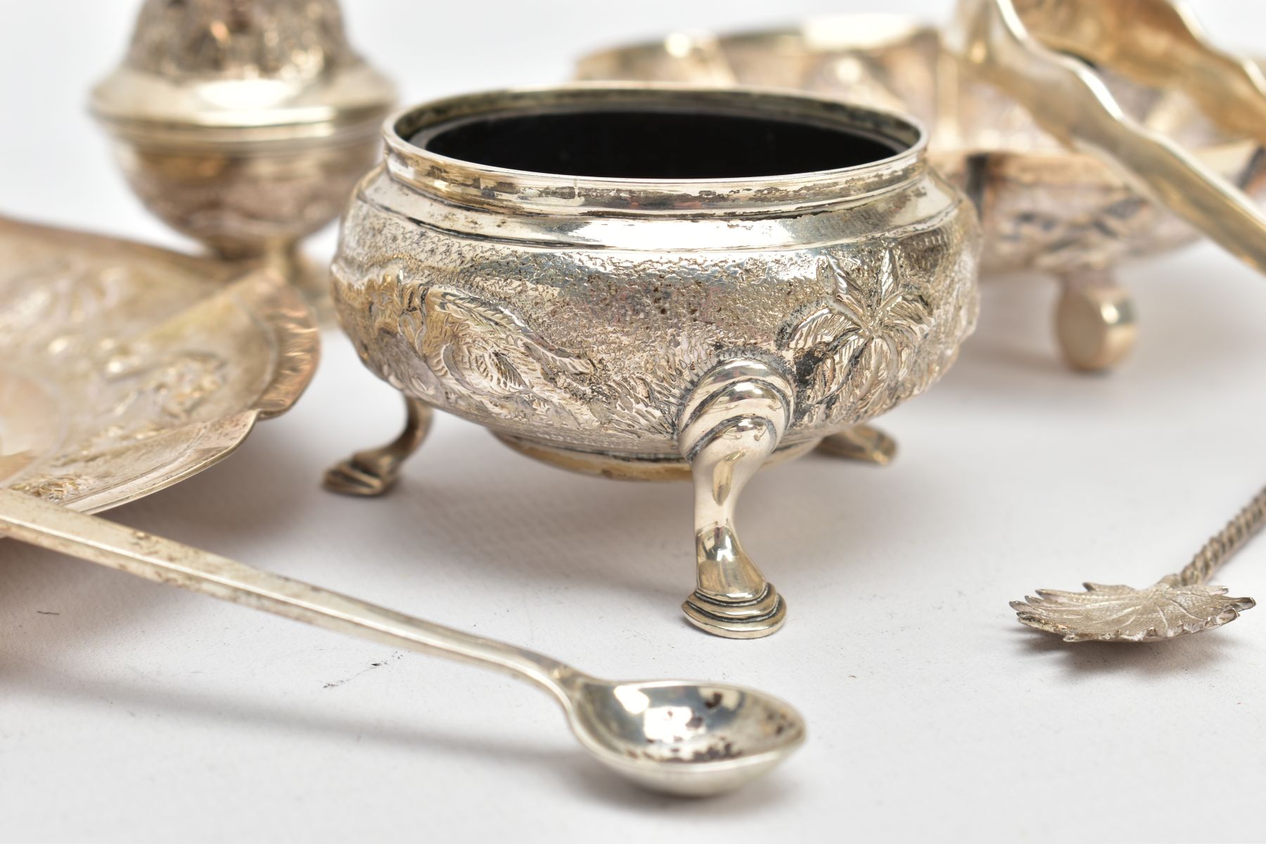A SELECTION OF INDIAN WHITE METAL ITEMS, to include a white metal tea strainer with a circular - Image 2 of 10