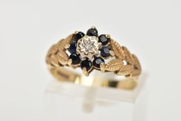 A 9CT GOLD SAPPHIRE AND DIAMOND CLUSTER RING, the cluster of a flower shape, set with a central