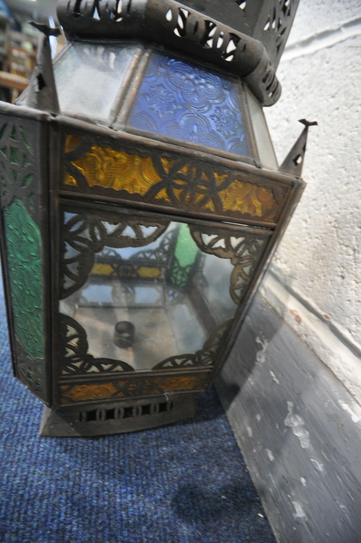 A 20TH CENTURY PRESSED METAL MOROCCAN HANGING LANTERN, with coloured glass panels, 20cm squared x - Image 3 of 4