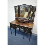 AN EDWARDIAN MAHOGANY DRESSING TABLE, with a triple mirror and seven assorted drawers, width 123cm x